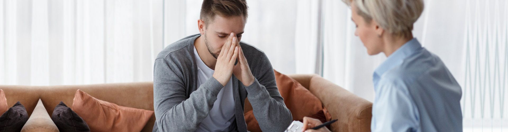 depressed man consulting his therapist